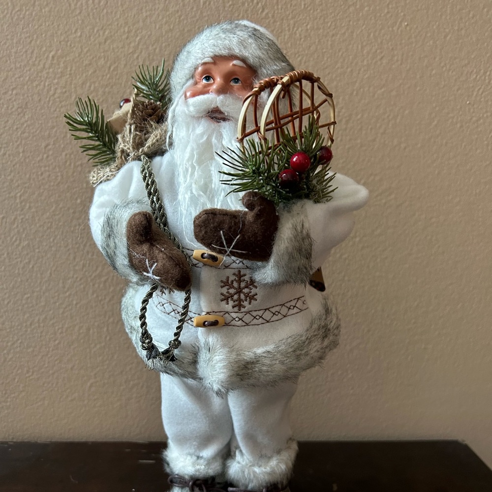 Santa Claus Wearing A Warm Fur Coat Holding A Jute Gift Bag